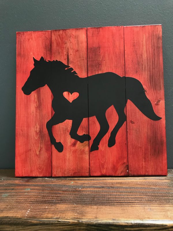 horse on red wood paneled background