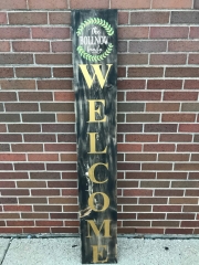 welcome with leaves on wood sign