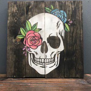 flower skull on wood paneling