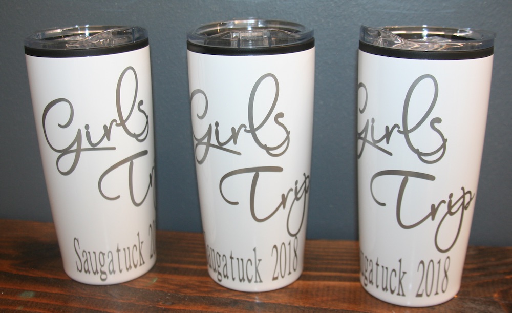 White to-go coffee mugs with silver writing 