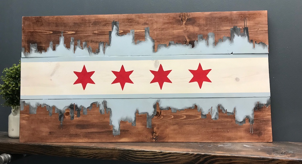 Wood sign with the Chicago flag and the skyline at the top and bottom